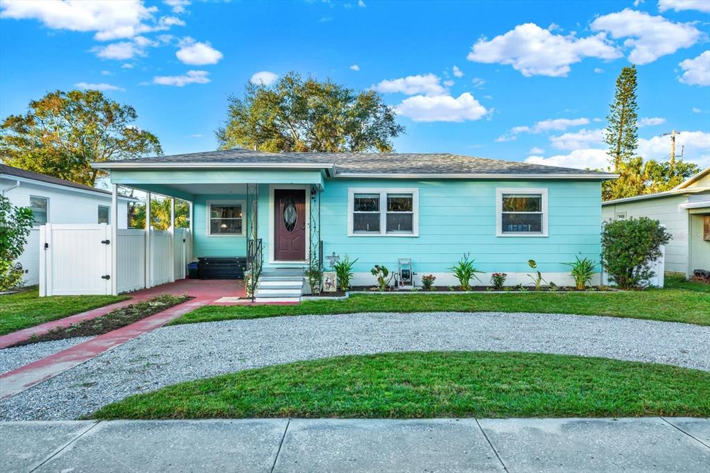 a front view of house with yard and green space