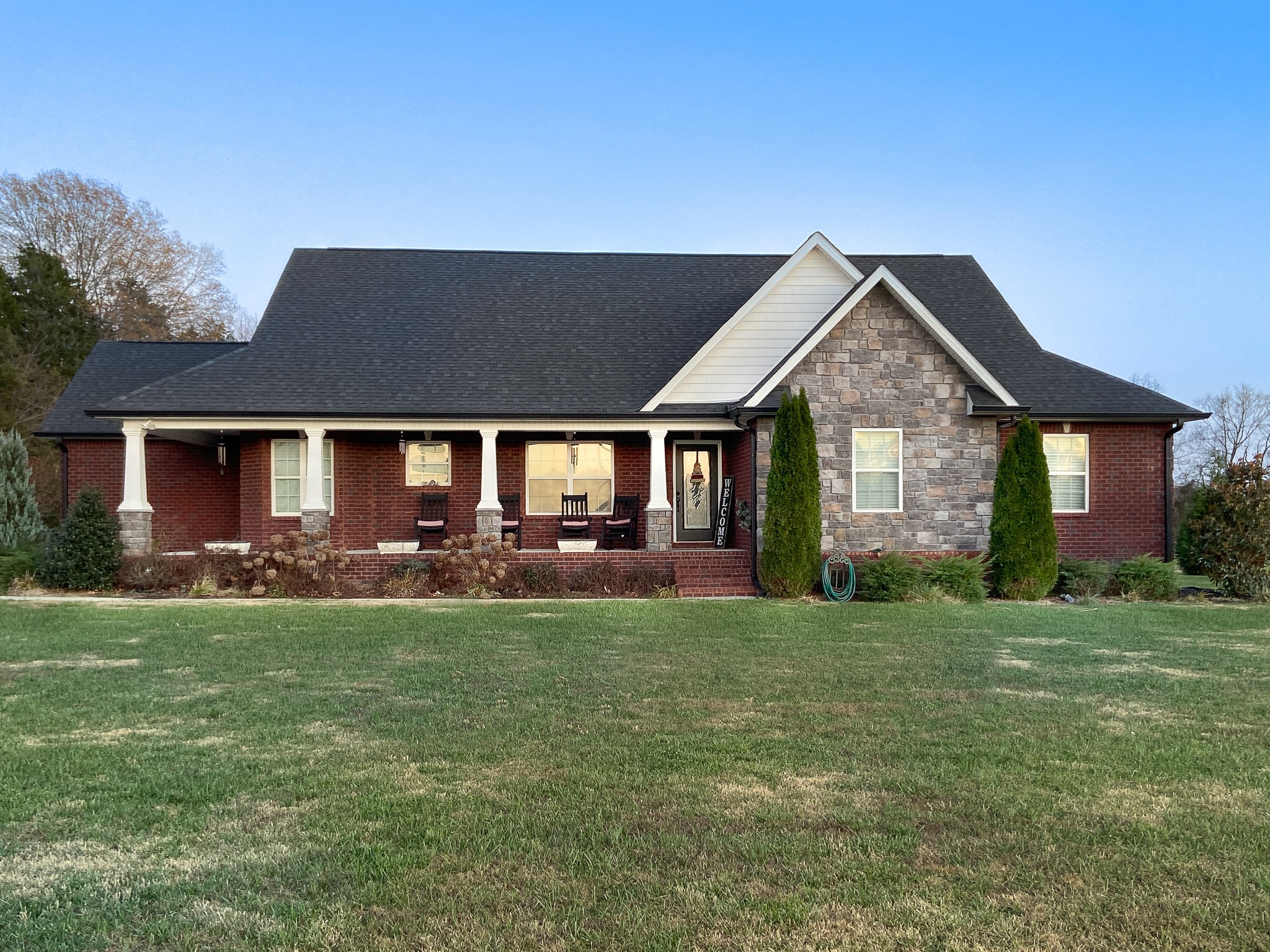 a front view of a house with a yard