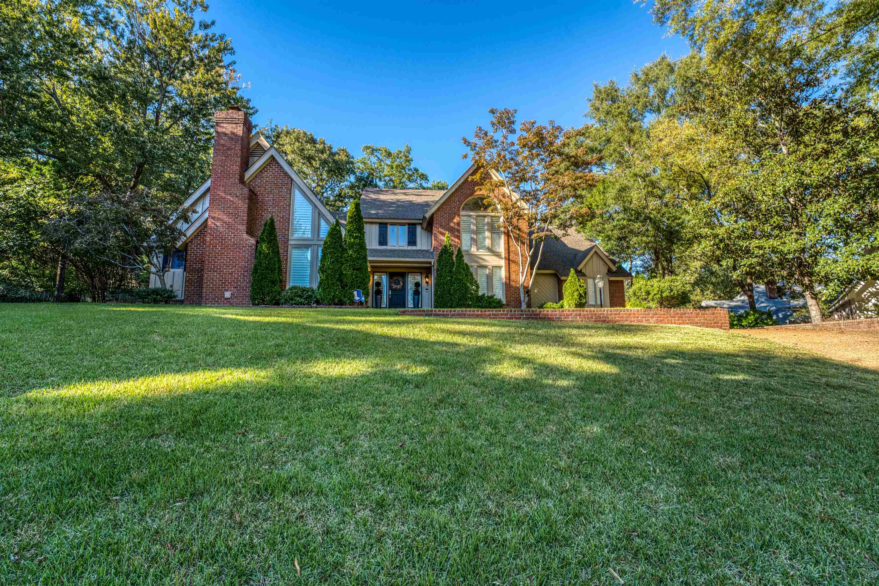 a view of a house with a big yard