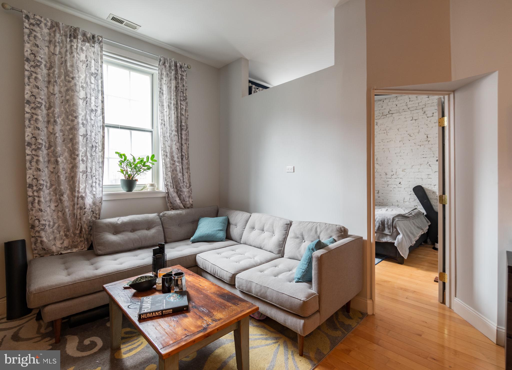 a living room with furniture and a window