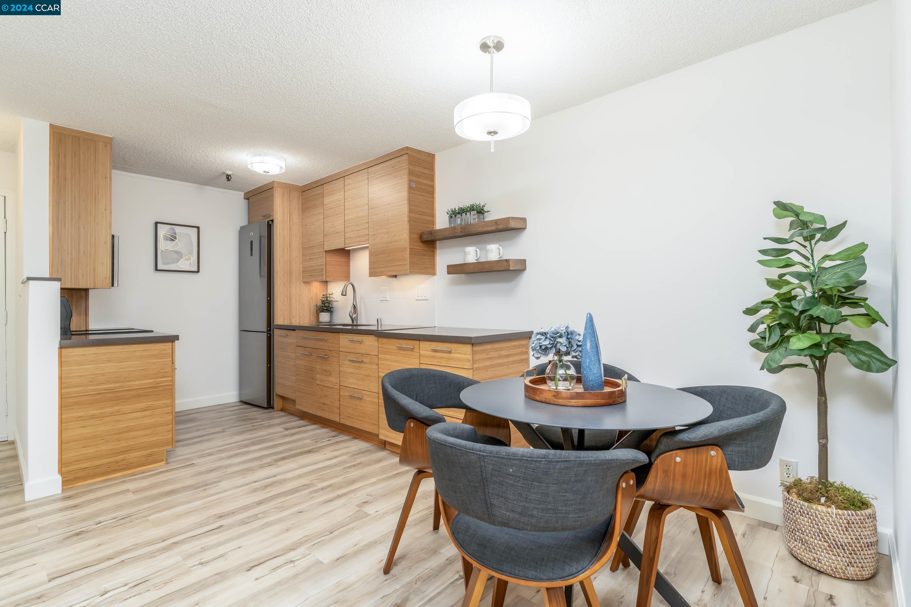 a dining room with furniture and wooden floor