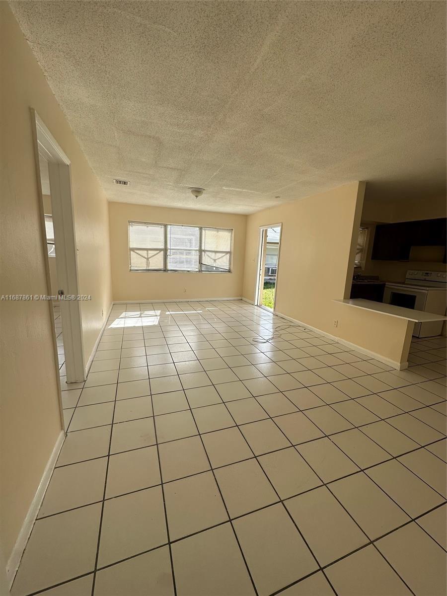 a view of an empty room and window