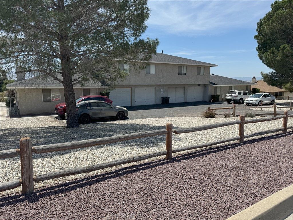 a view of a car park side of the house