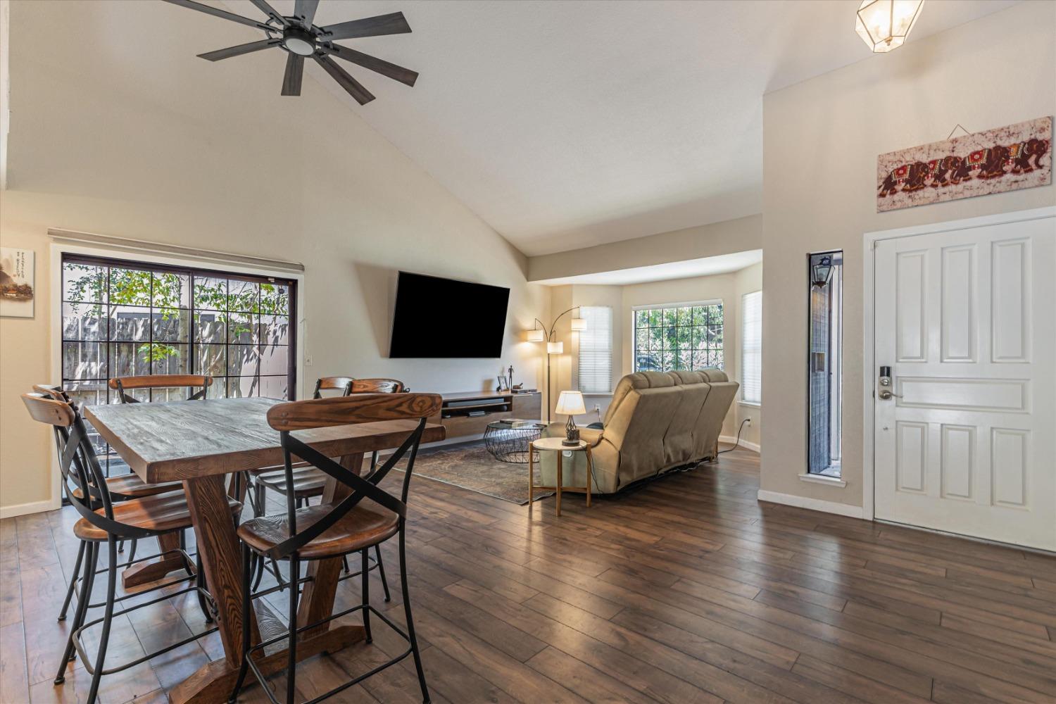 a view of a livingroom with furniture and a flat screen tv