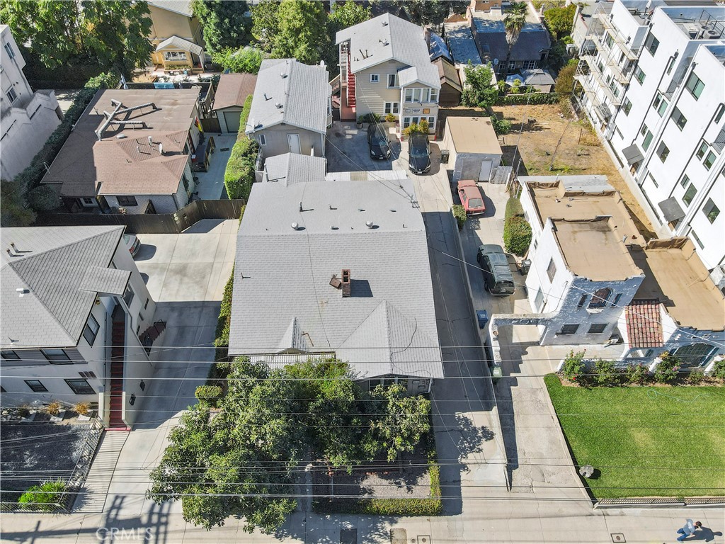 an aerial view of residential houses with outdoor space