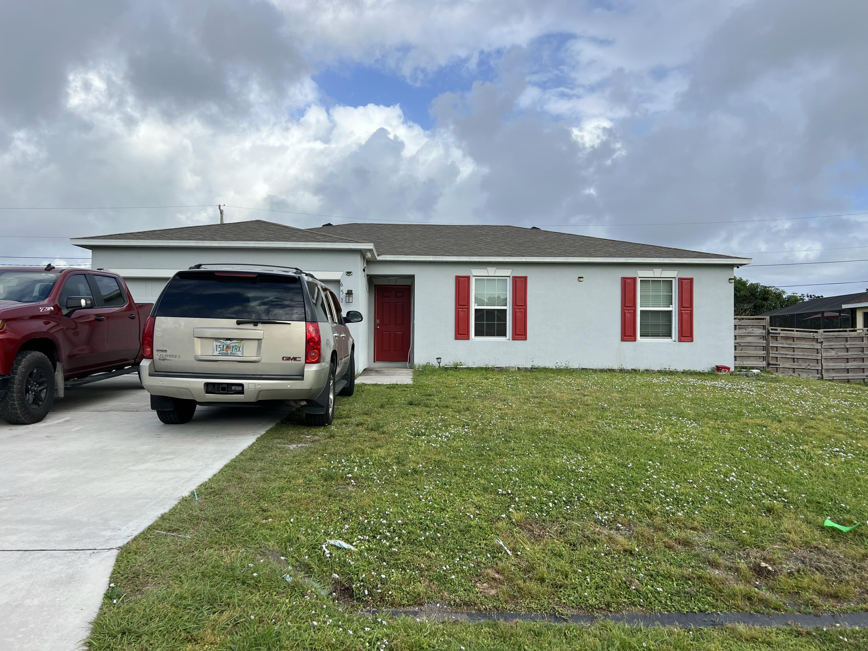 a view of a car in front of a house