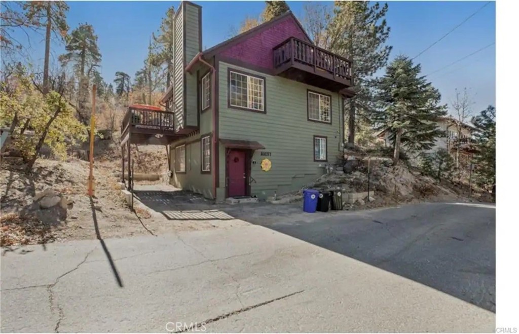 a view of a house with a yard and garage