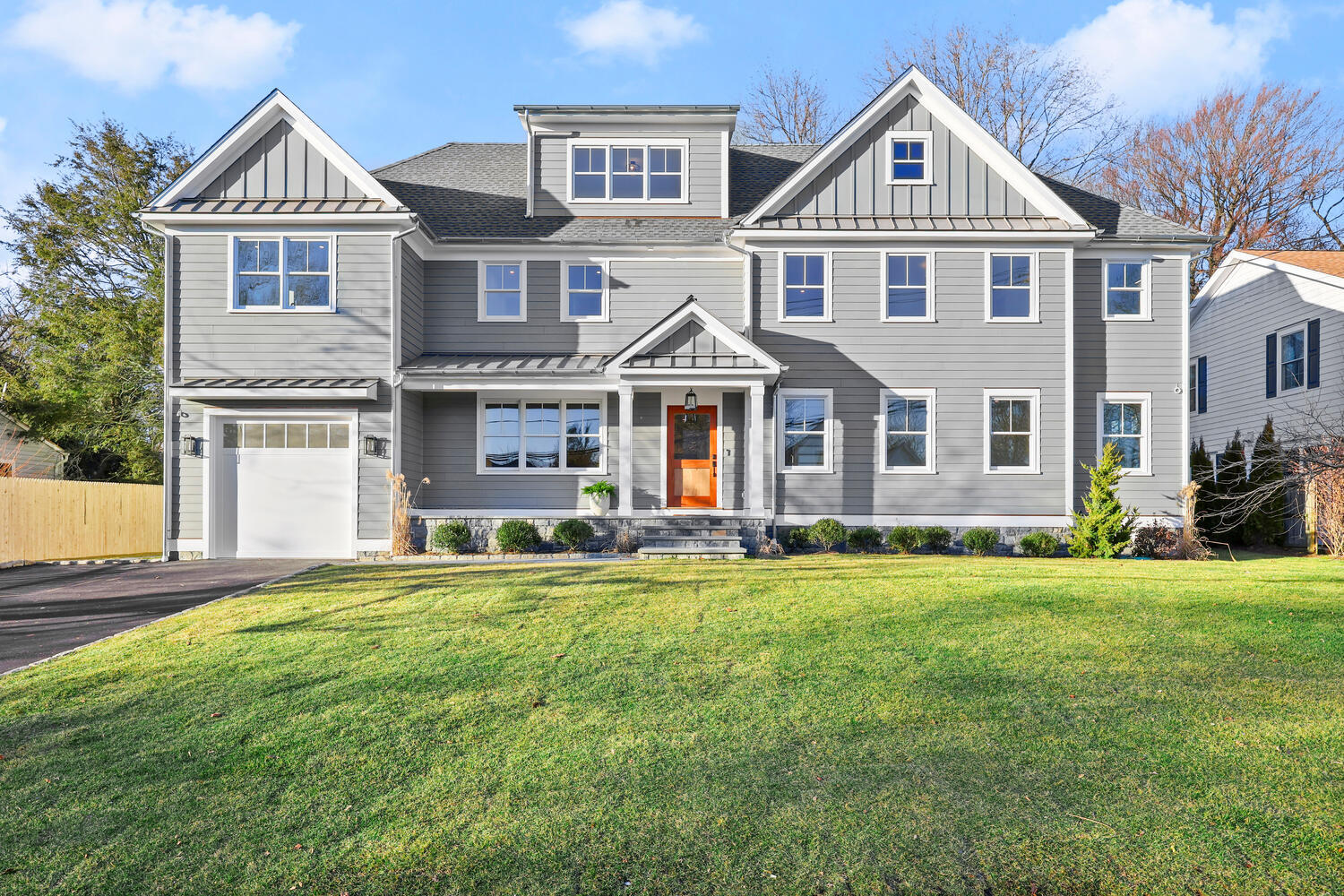 a front view of a house with a garden