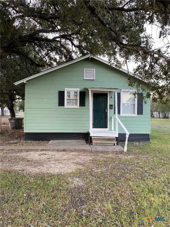 a house with yard in front of it