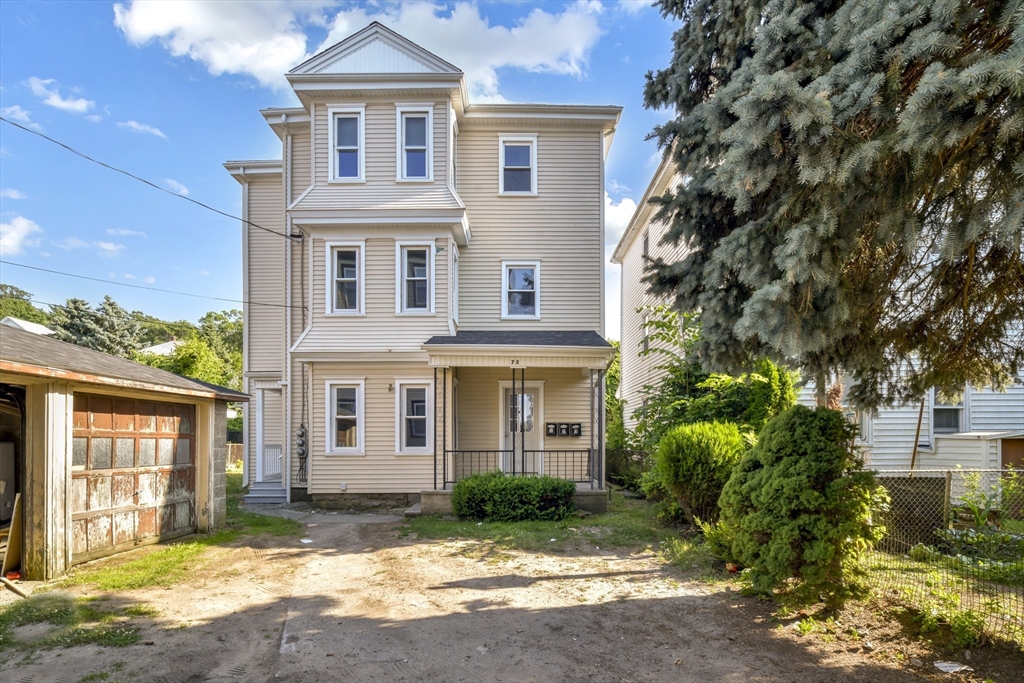 a front view of a house with a yard