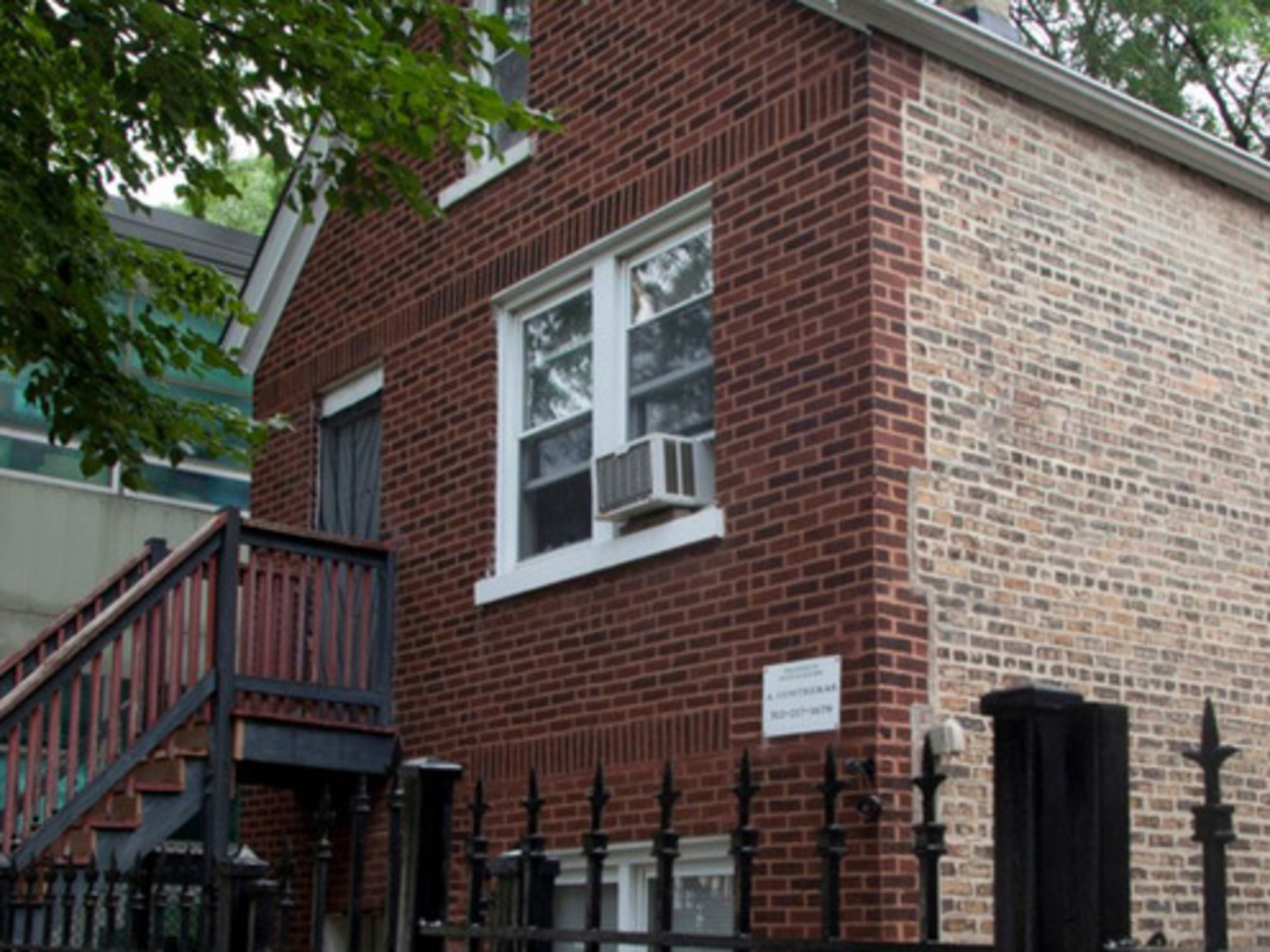 a front view of a house with a glass door