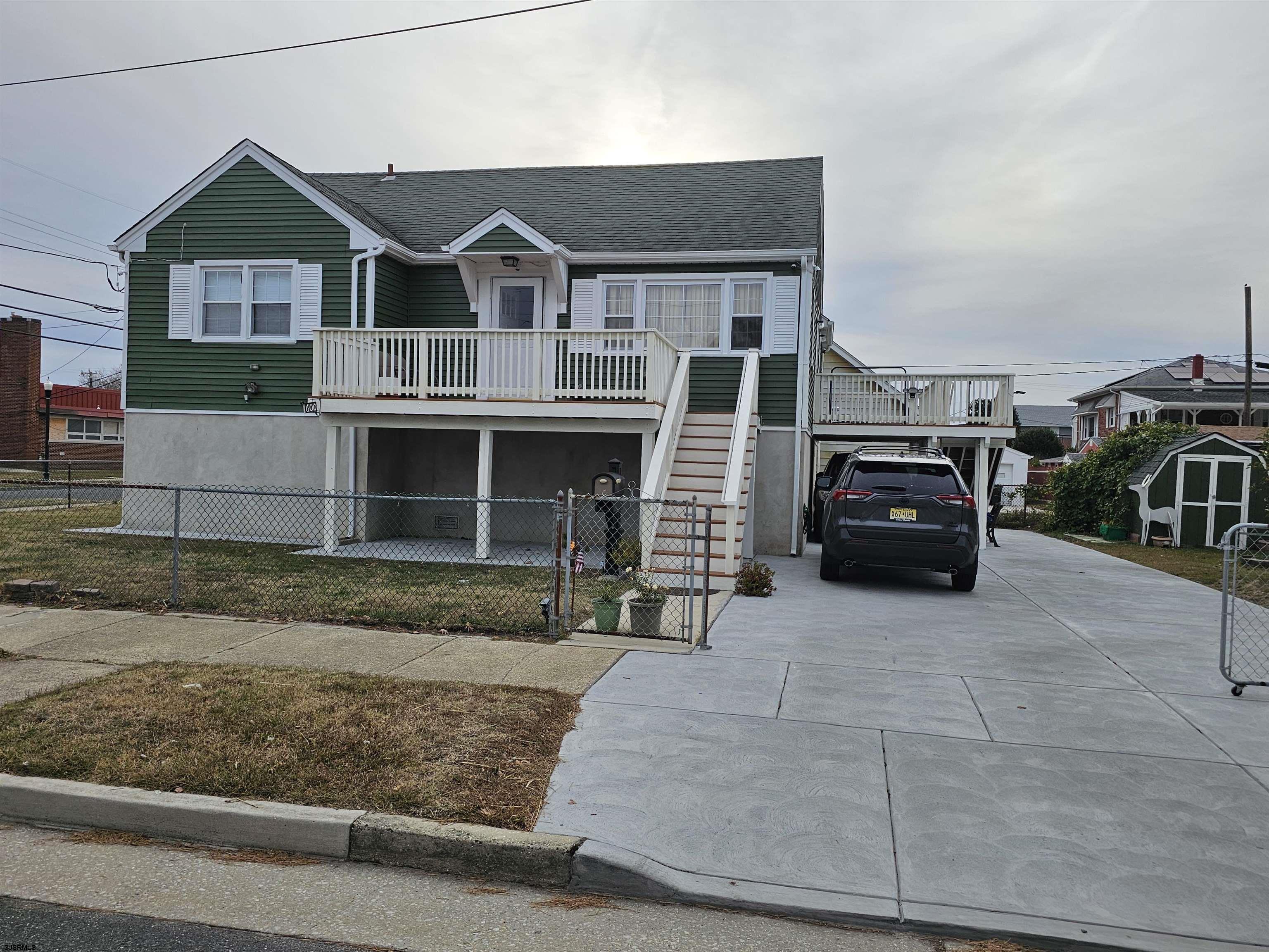 a view of a car park in front of house