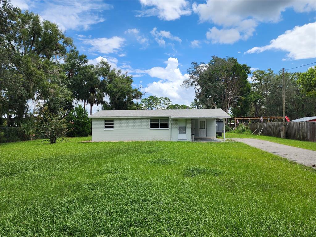 a view of a backyard of the house