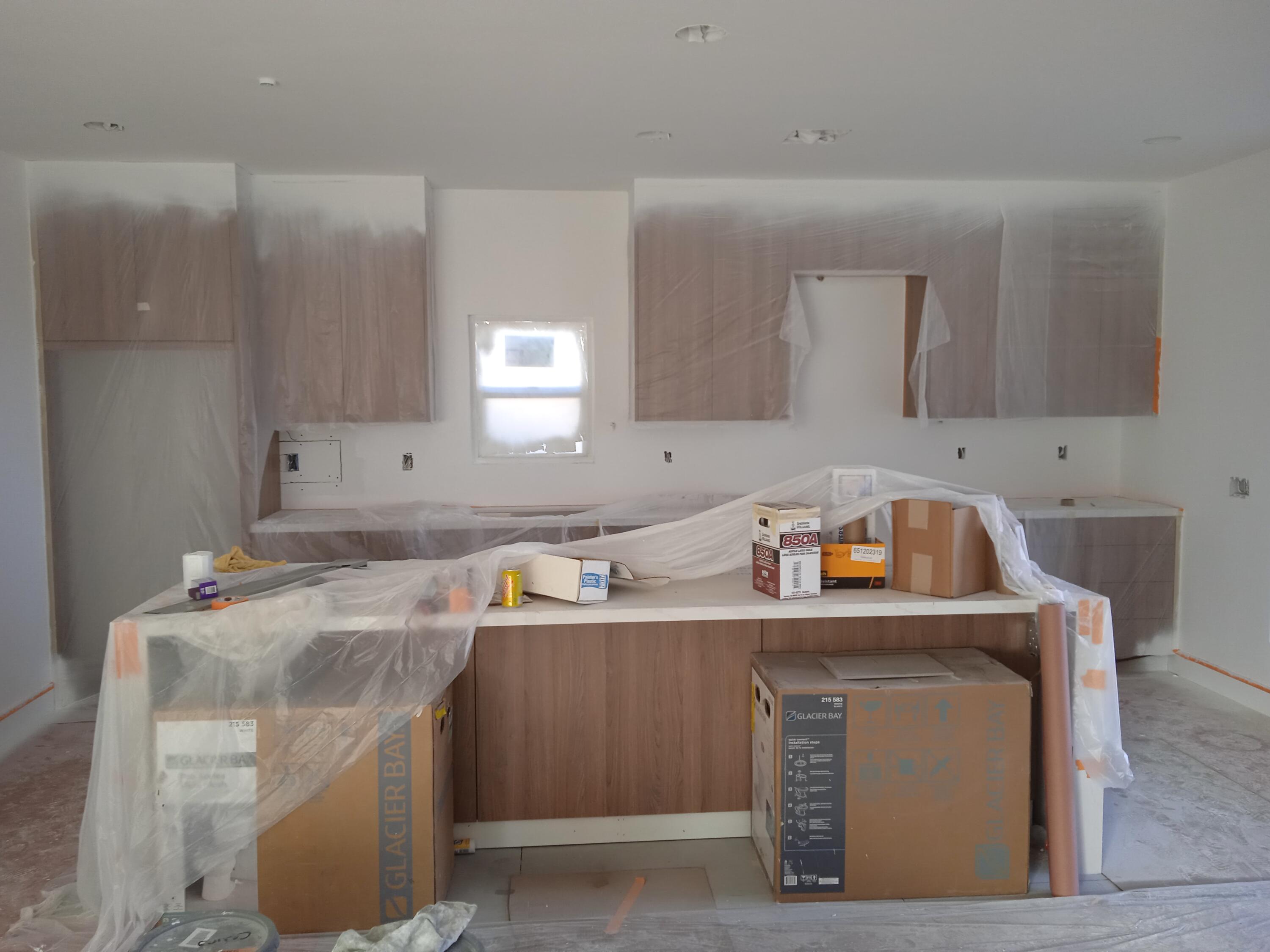 a utility room with sink dryer and washer