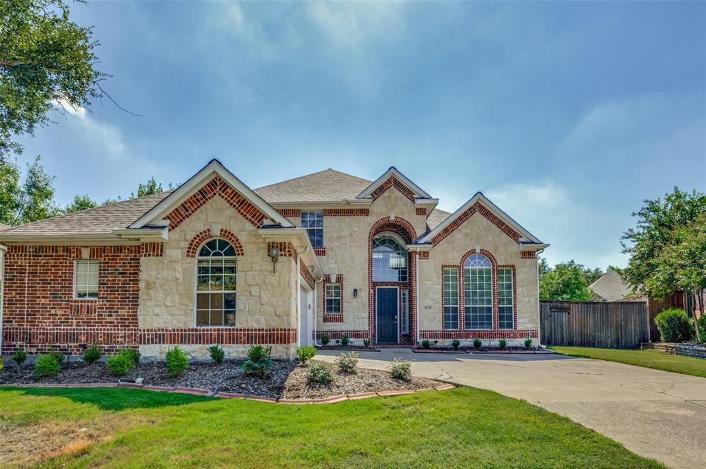 front view of a house with a yard