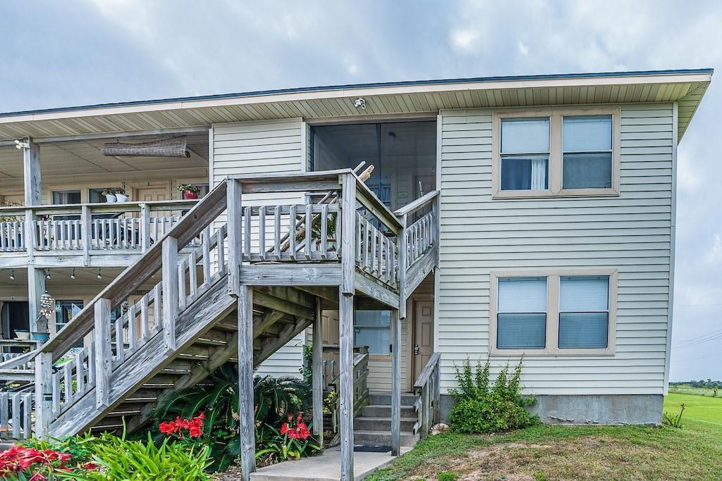 a view of front door of house with deck