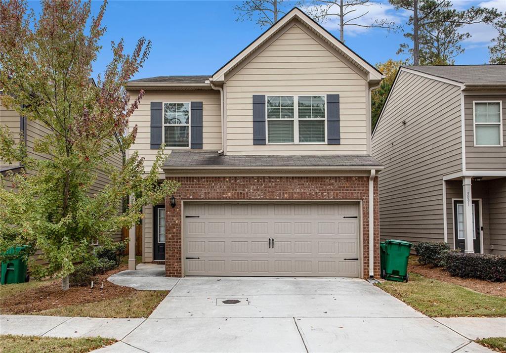 a front view of a house with garage