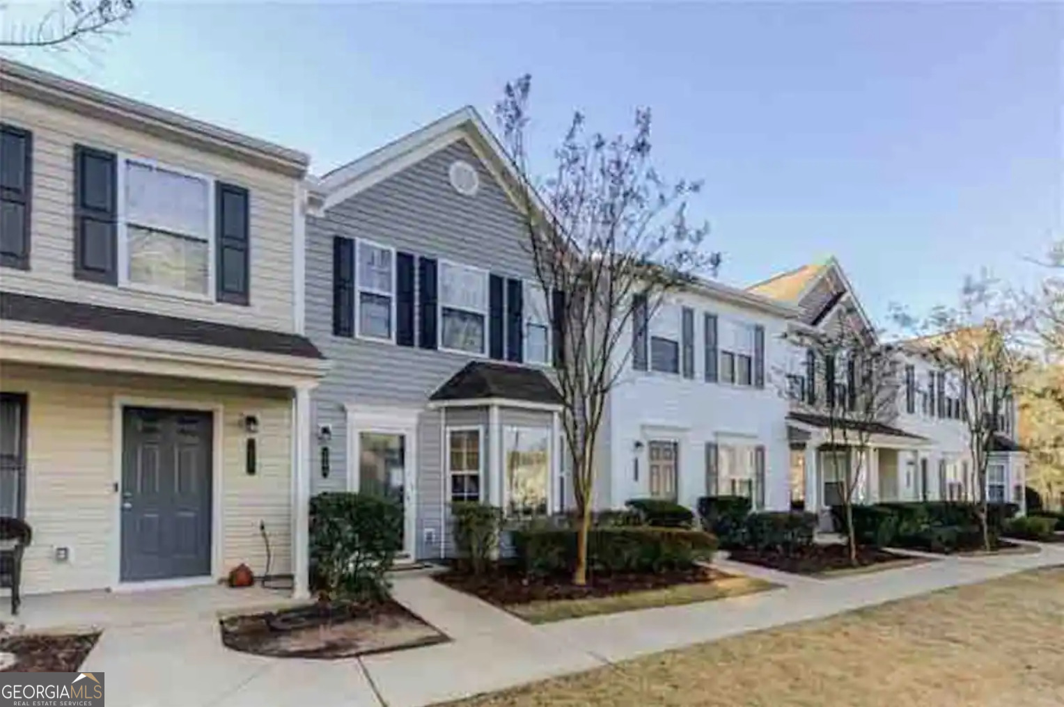 a front view of a house with a yard