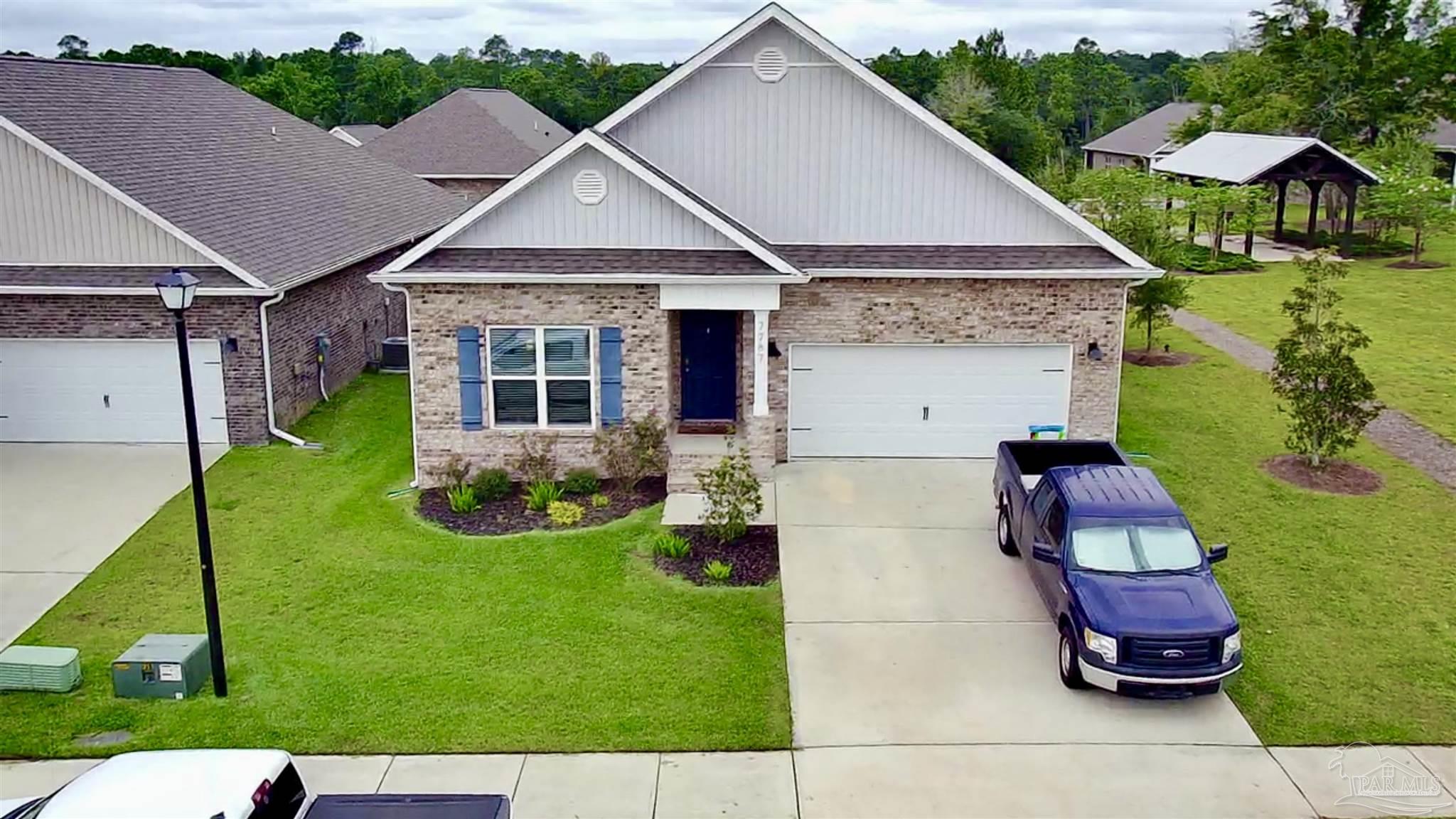 a front view of house with yard and outdoor seating