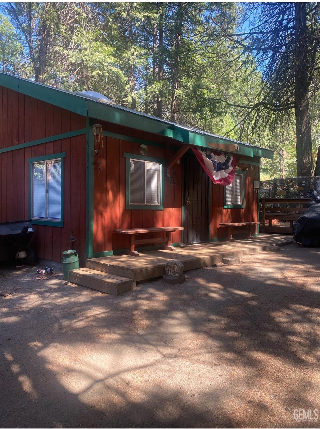 a view of a car park in front of a house