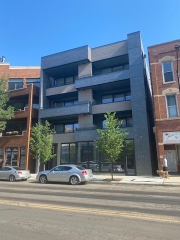 a view of a car parked in front of a building