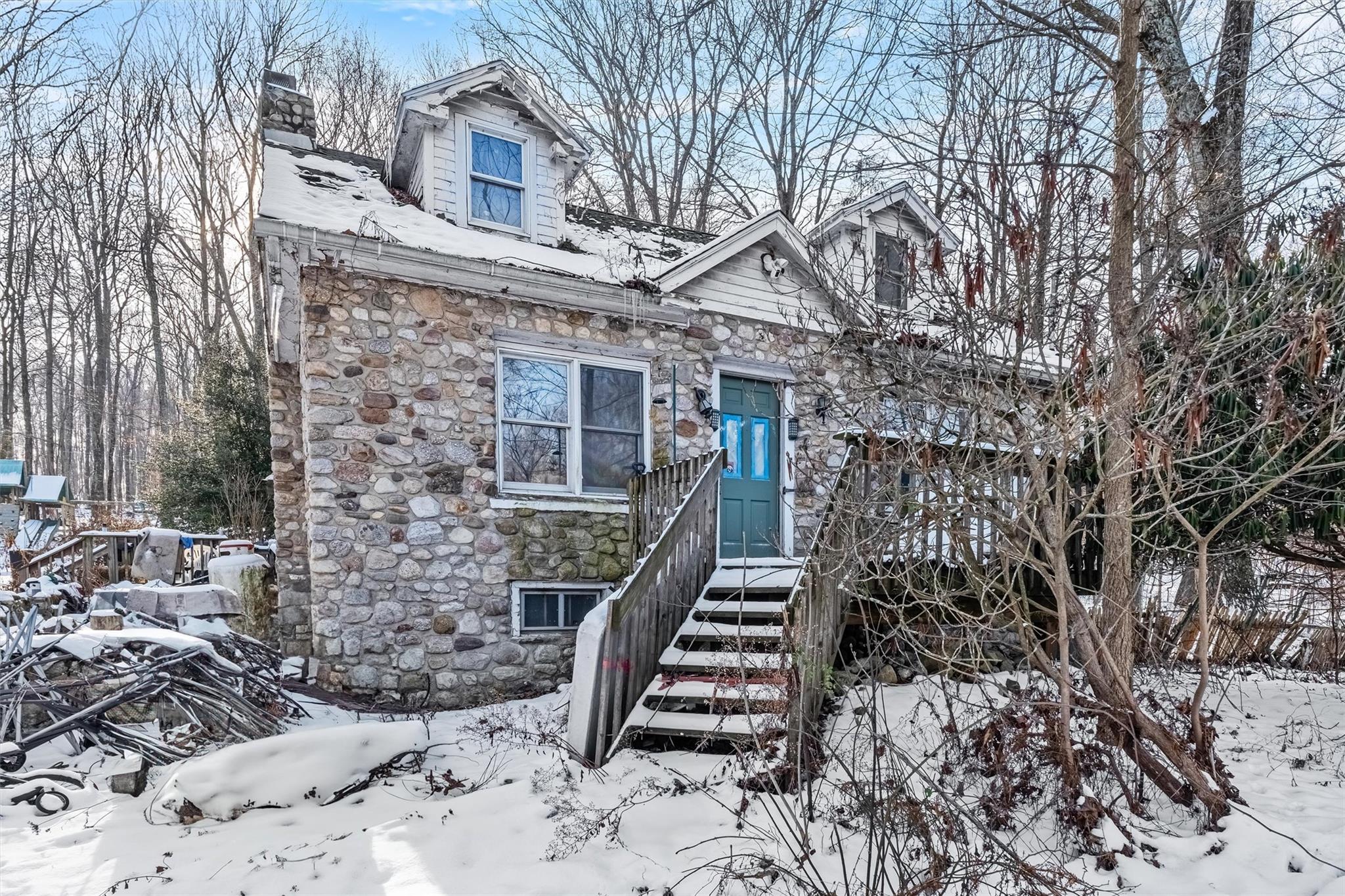 a front view of a house with stairs