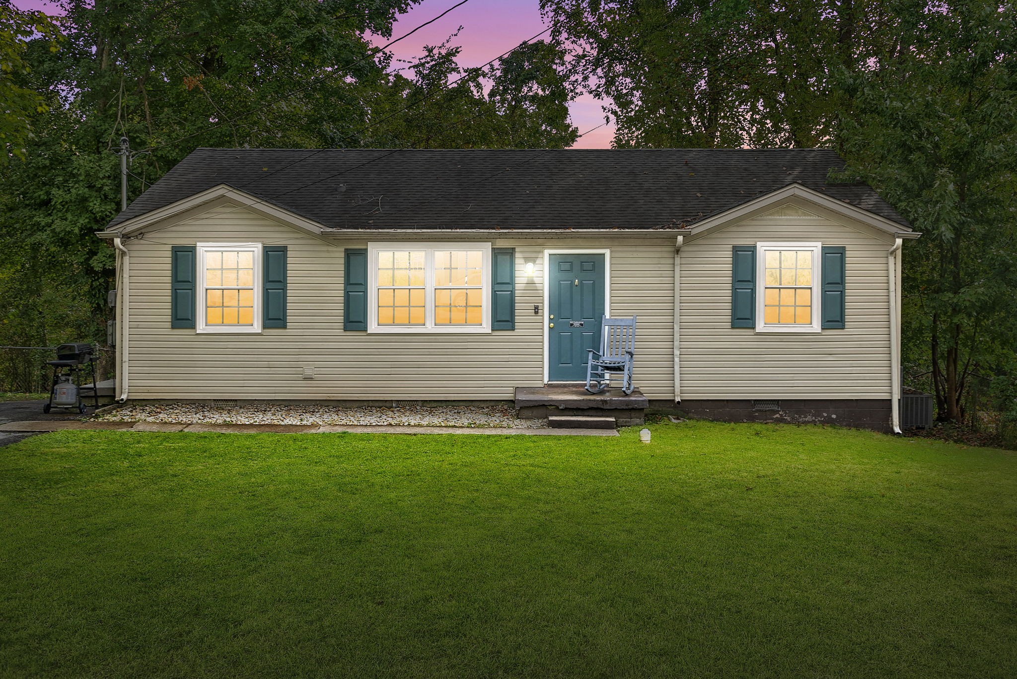 a front view of a house with a yard