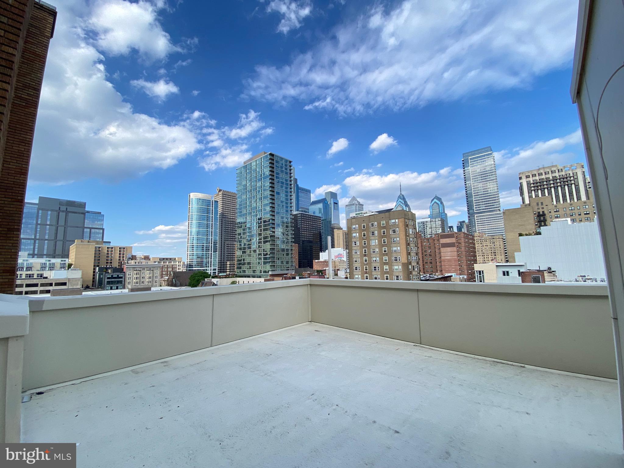 a view of a city with tall buildings