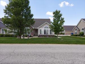 a view of house with outdoor space and tree s