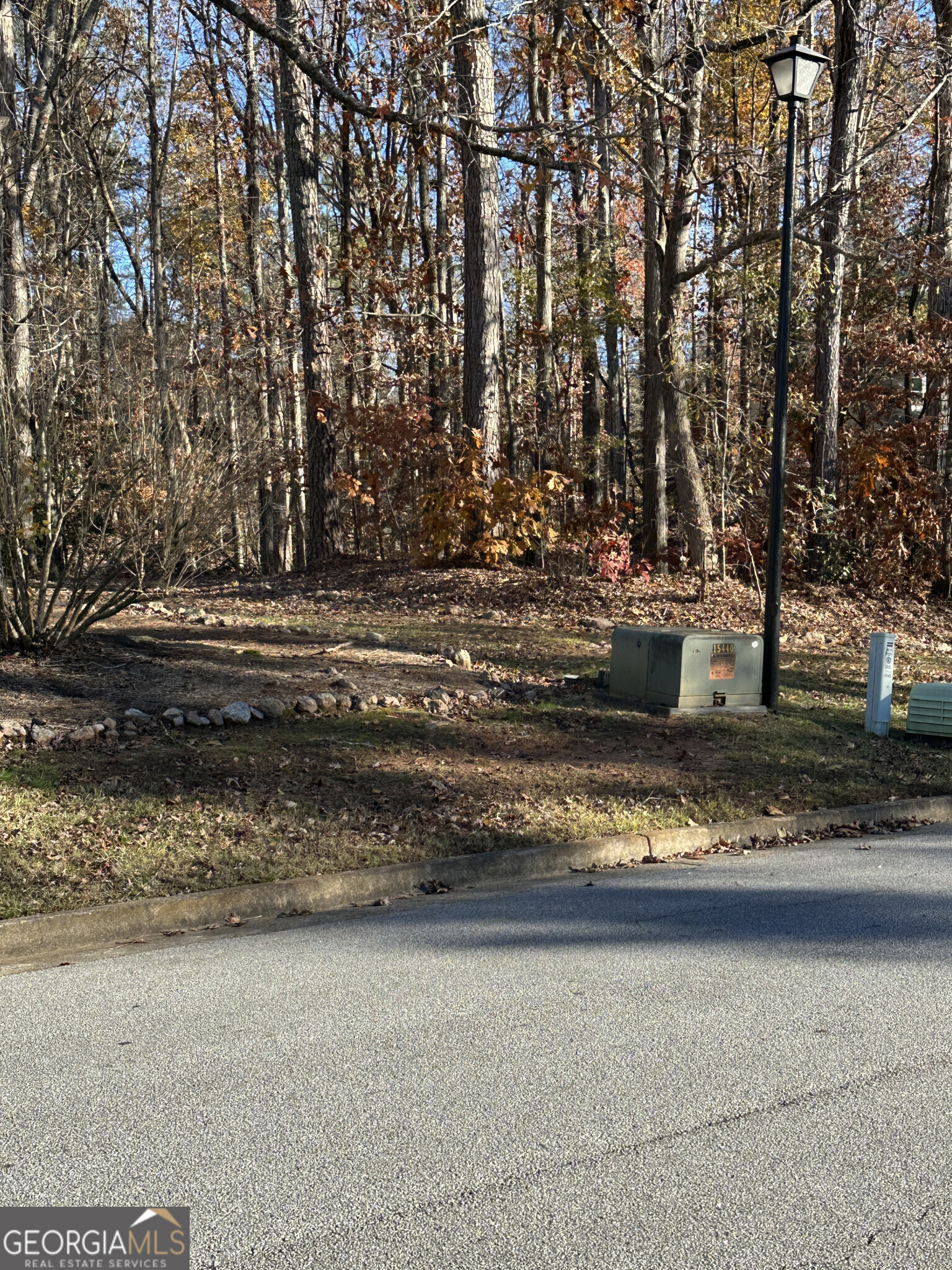 a view of yard with wooden fence