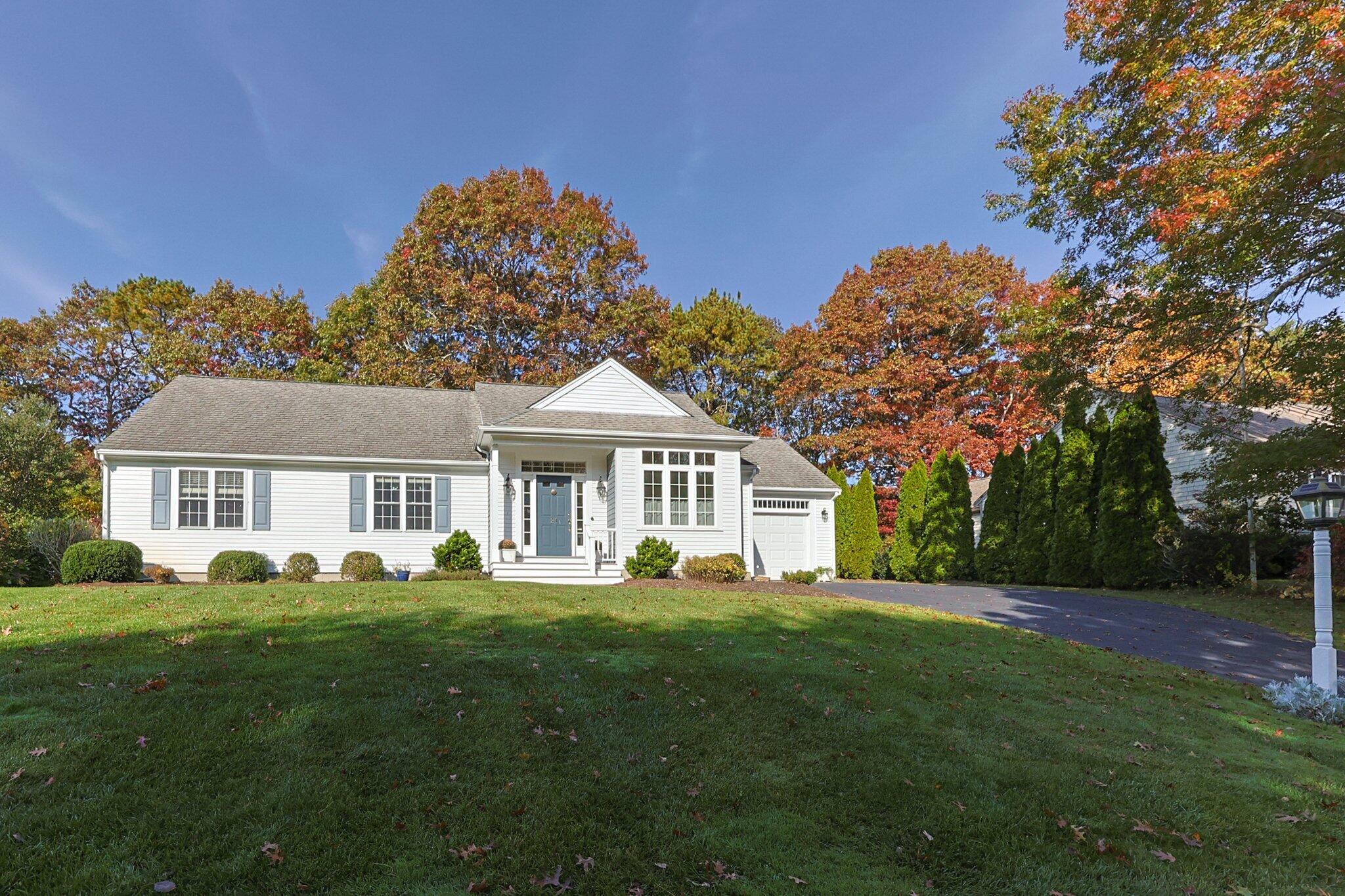 a front view of a house with a garden