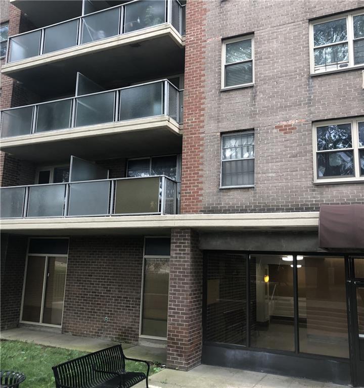 a black and white building with a large window