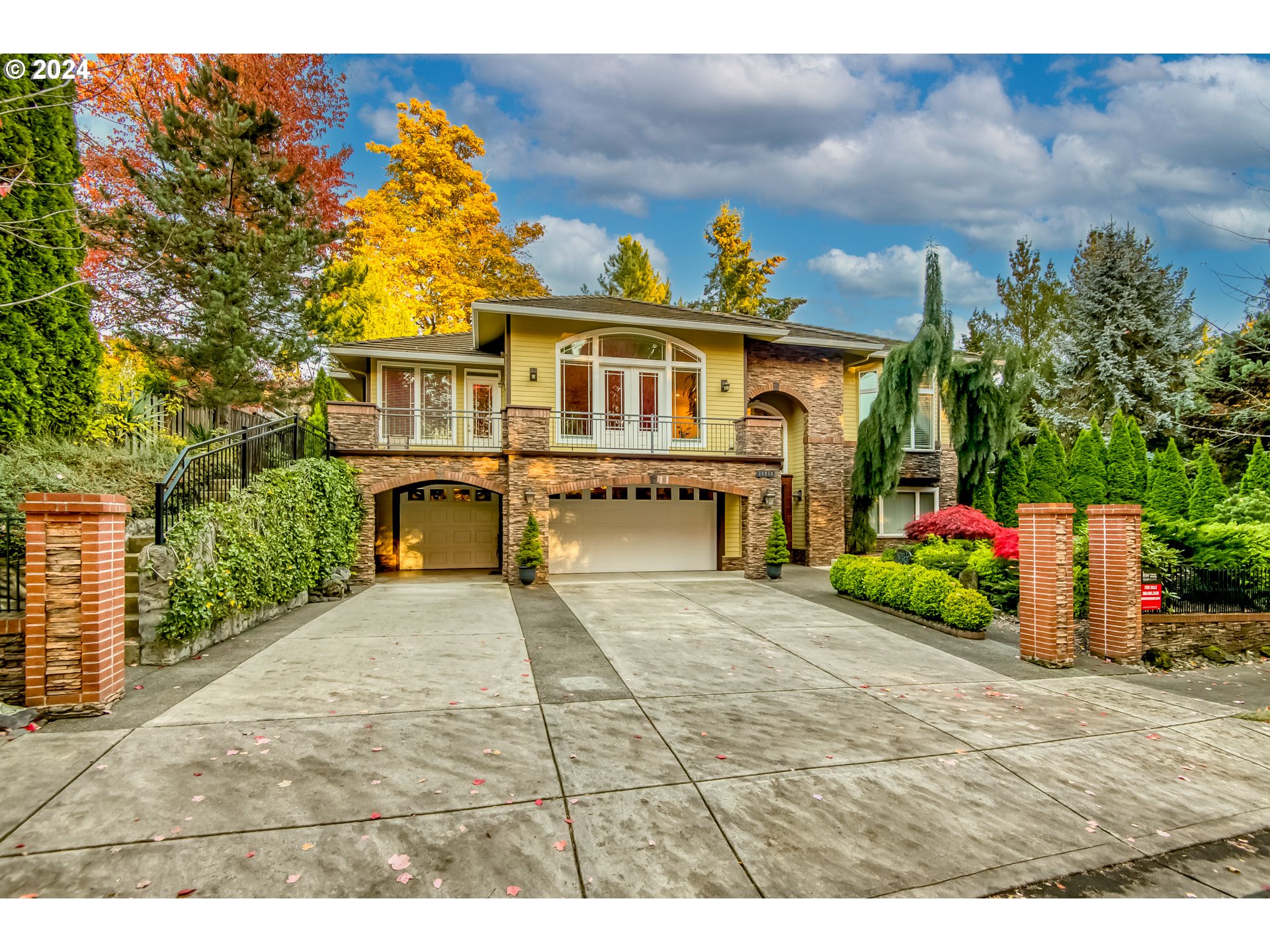 a view of a house with a yard and garage