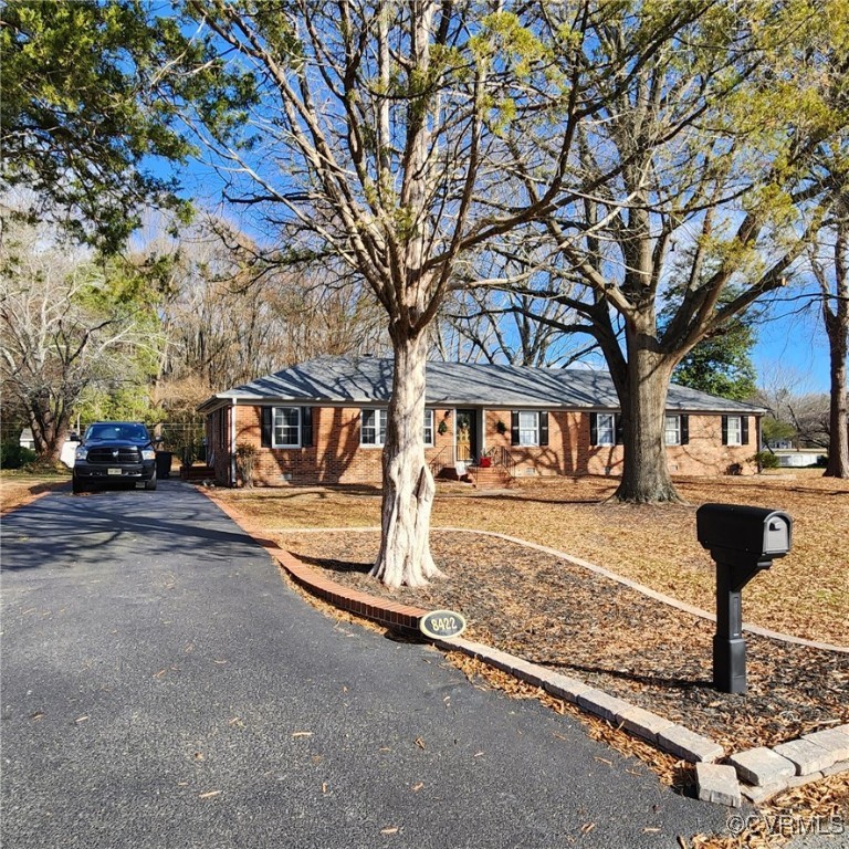 a front view of a house with parking area