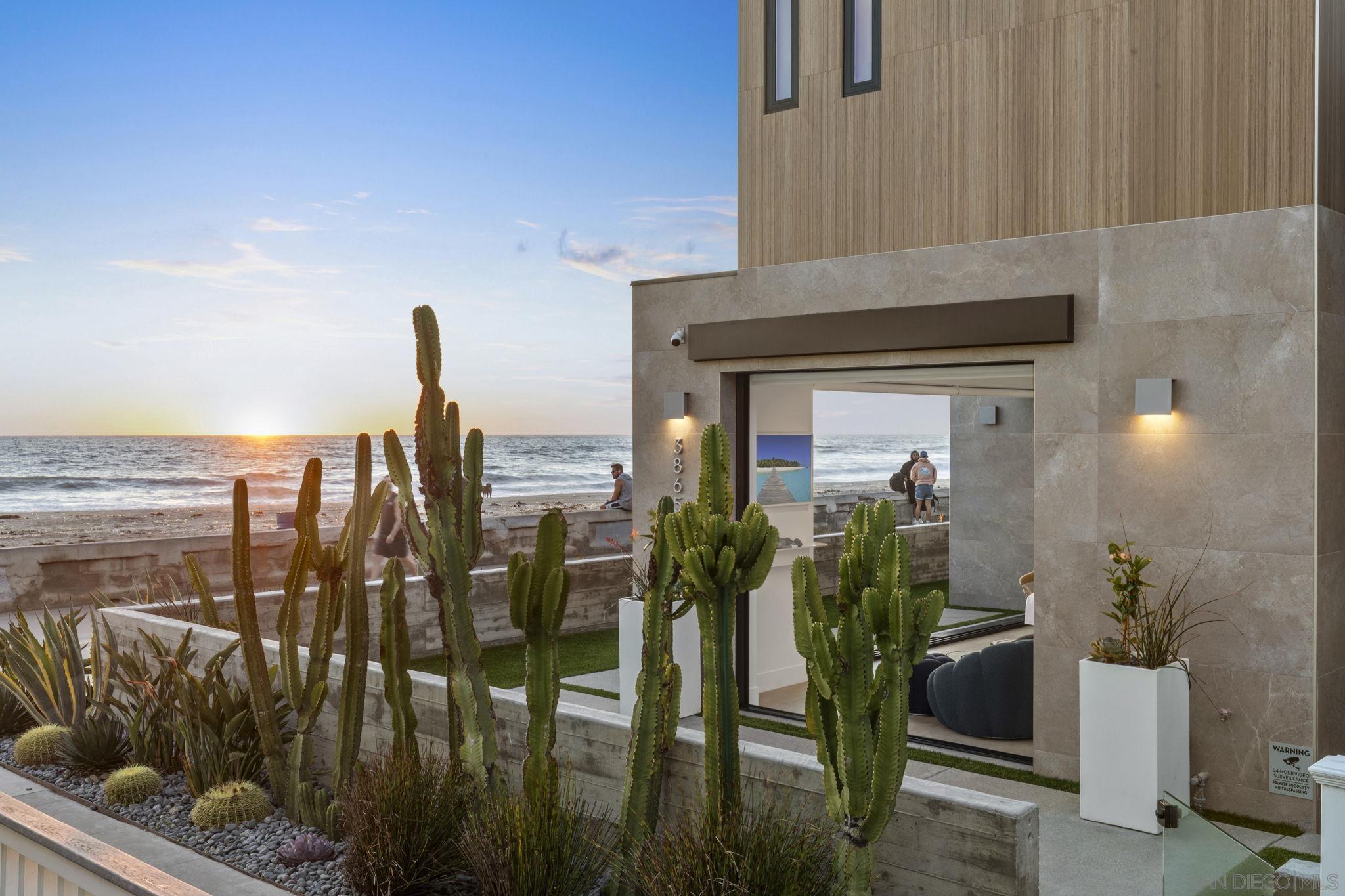 a front view of a house with outdoor seating