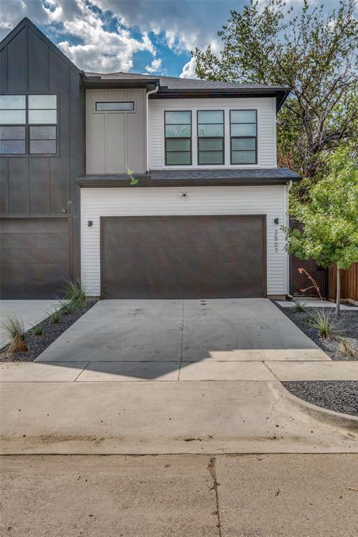 a front view of a house with garage