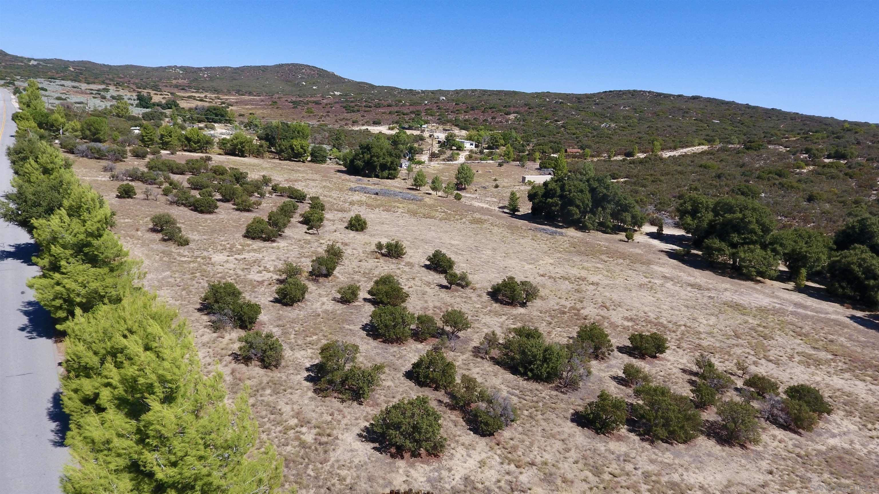 a view of a yard with a mountain