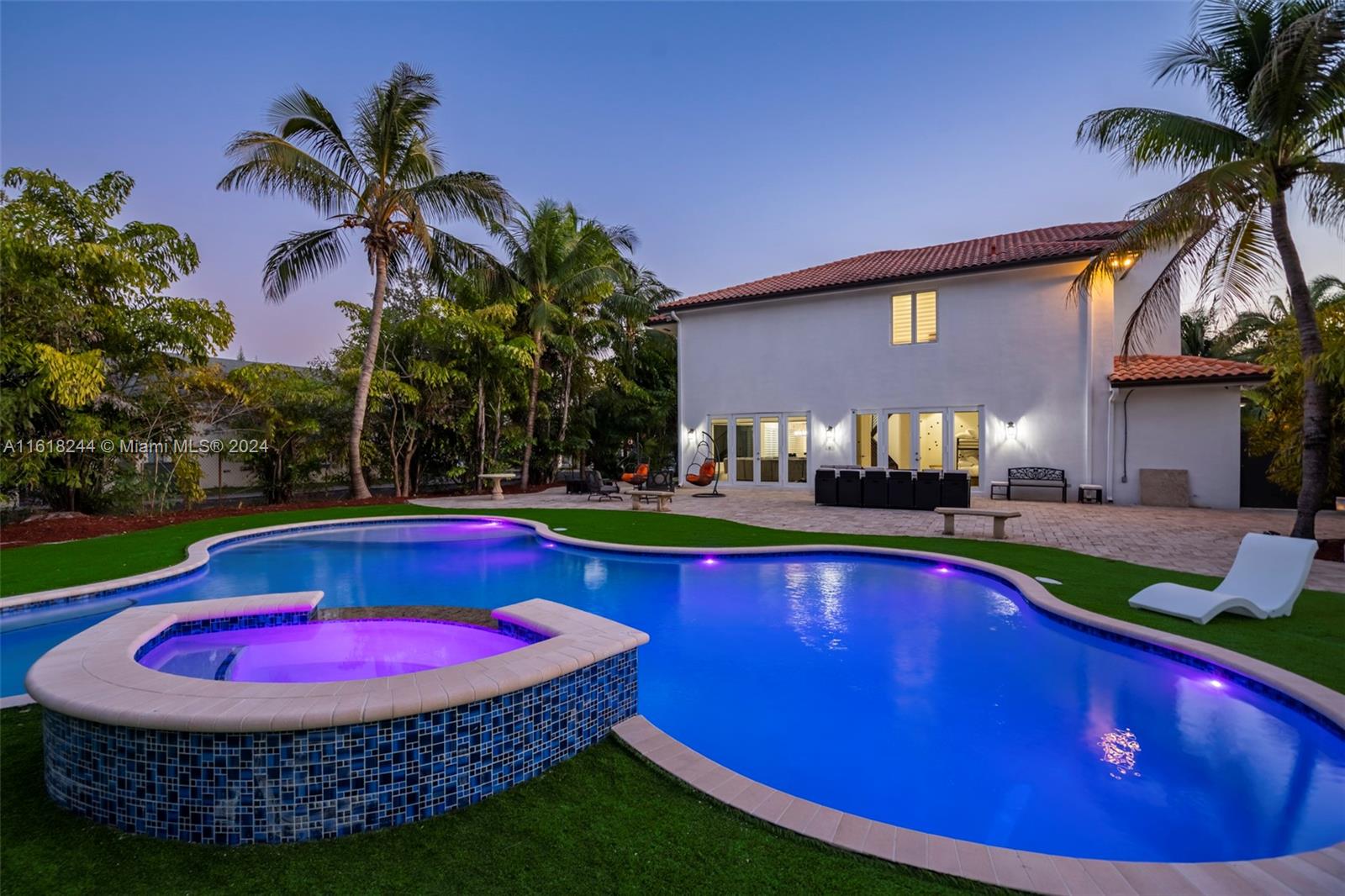 a view of swimming pool with outdoor seating