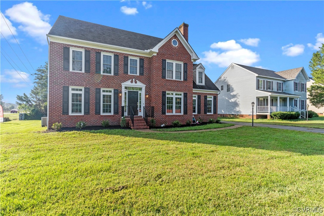 a front view of a house with a yard