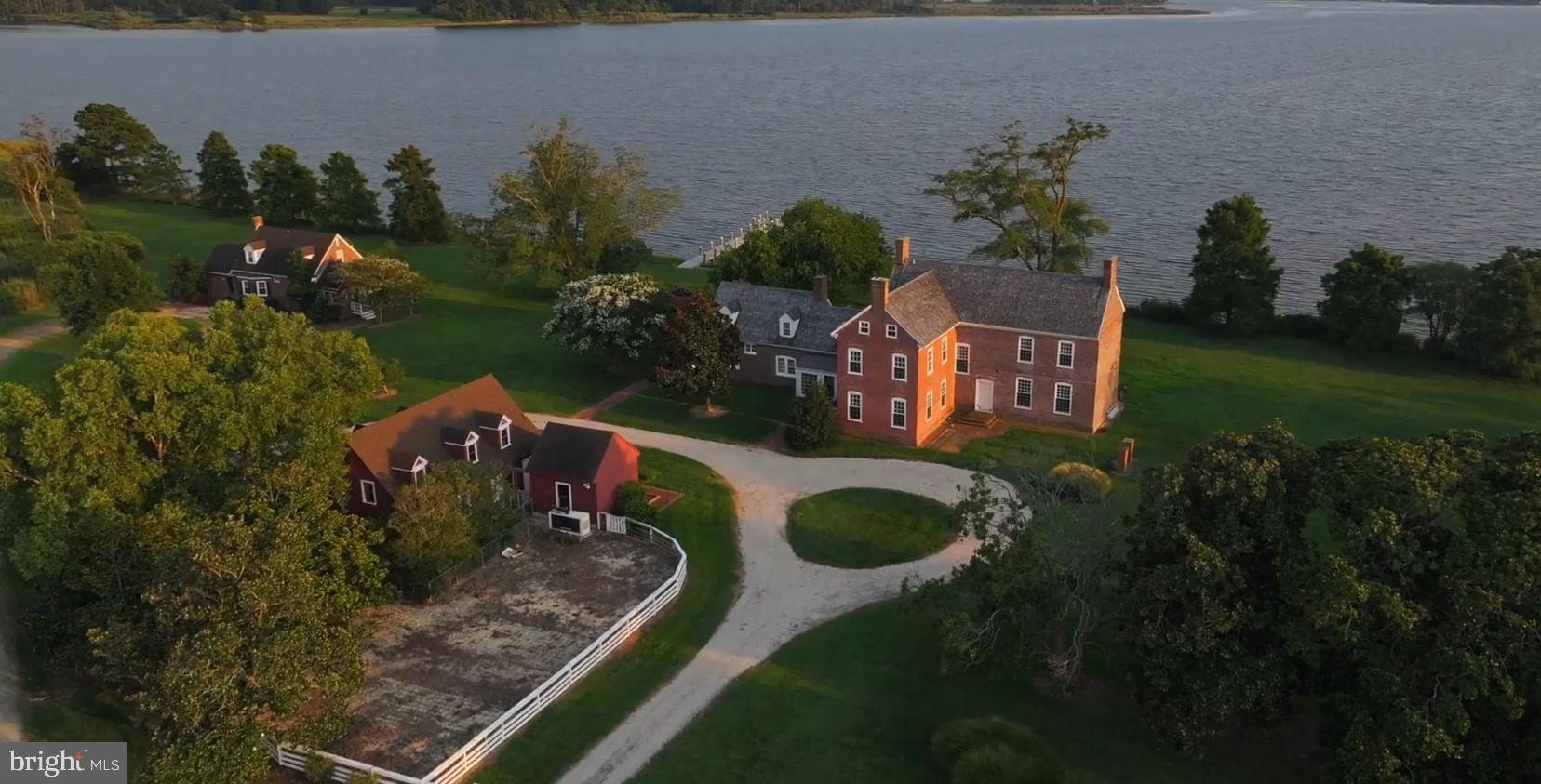 an aerial view of a house with yard swimming pool and outdoor seating