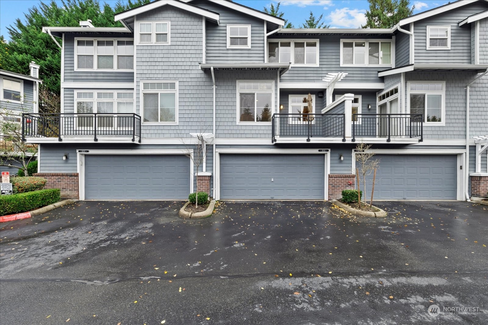 a front view of a house with garage