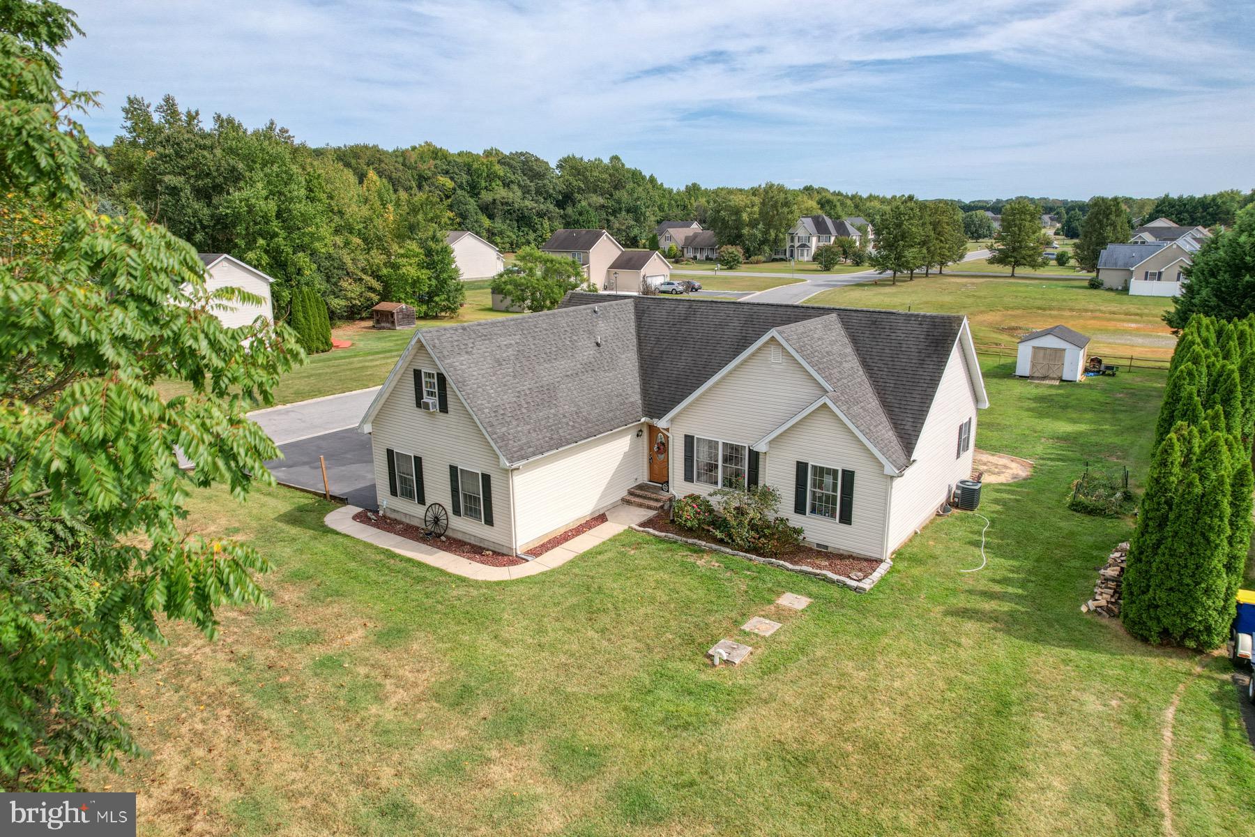 an aerial view of a house with a garden and plants