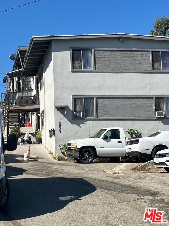 a front view of a house with parking space