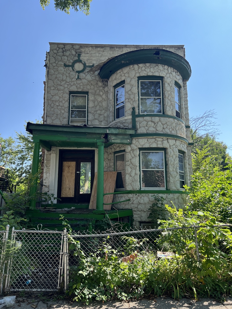 front view of a house with a small yard