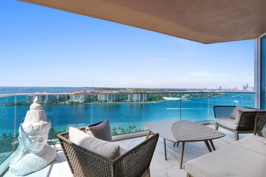 a terrace with outdoor seating and city view