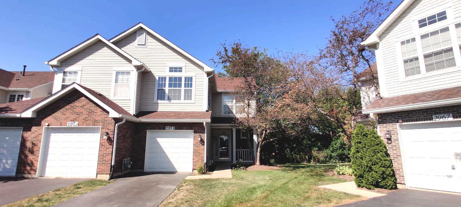 a front view of a house with a yard