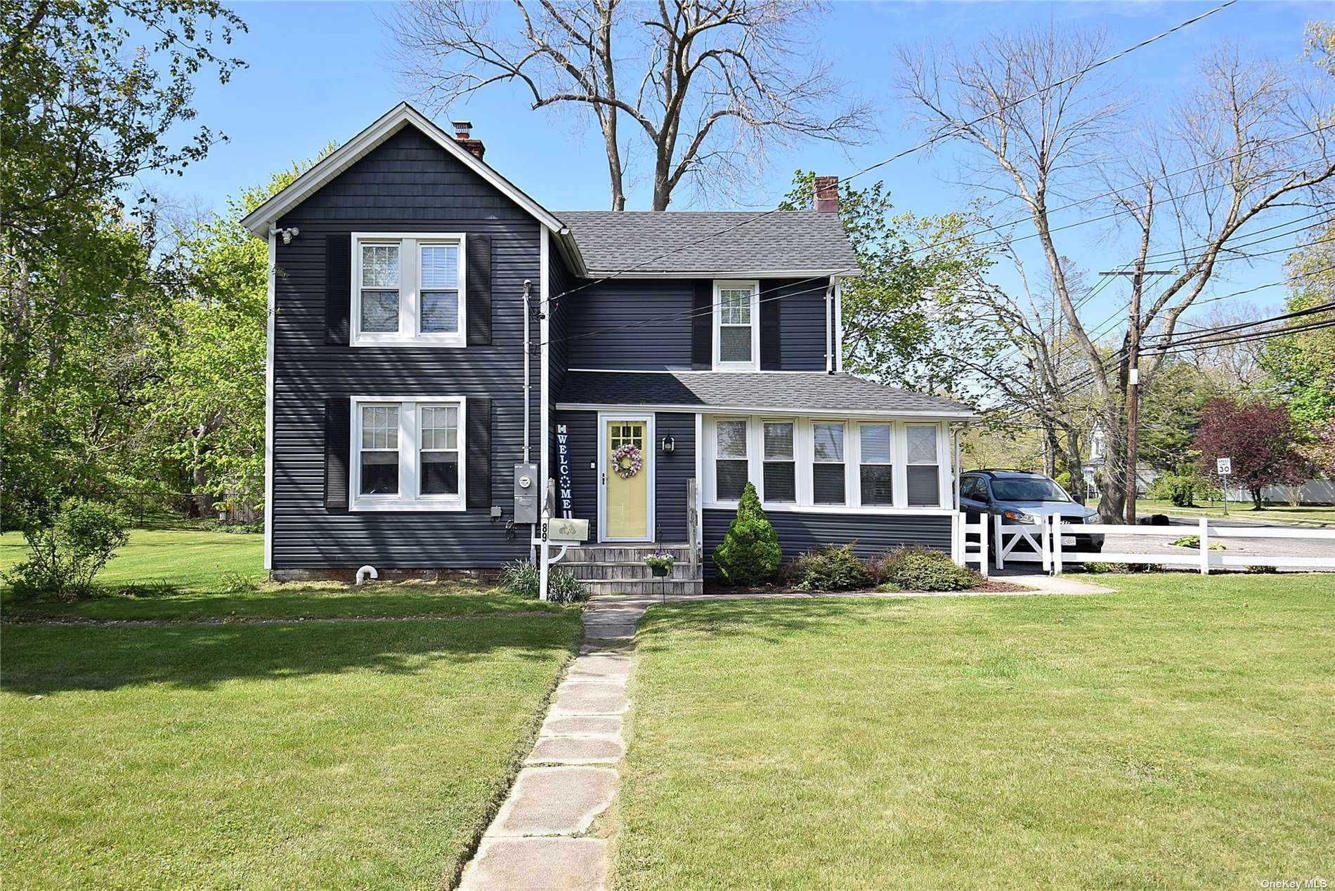 a front view of a house with a yard