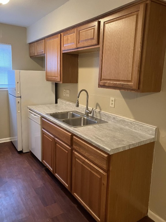 a kitchen with a sink cabinets and stainless steel appliances