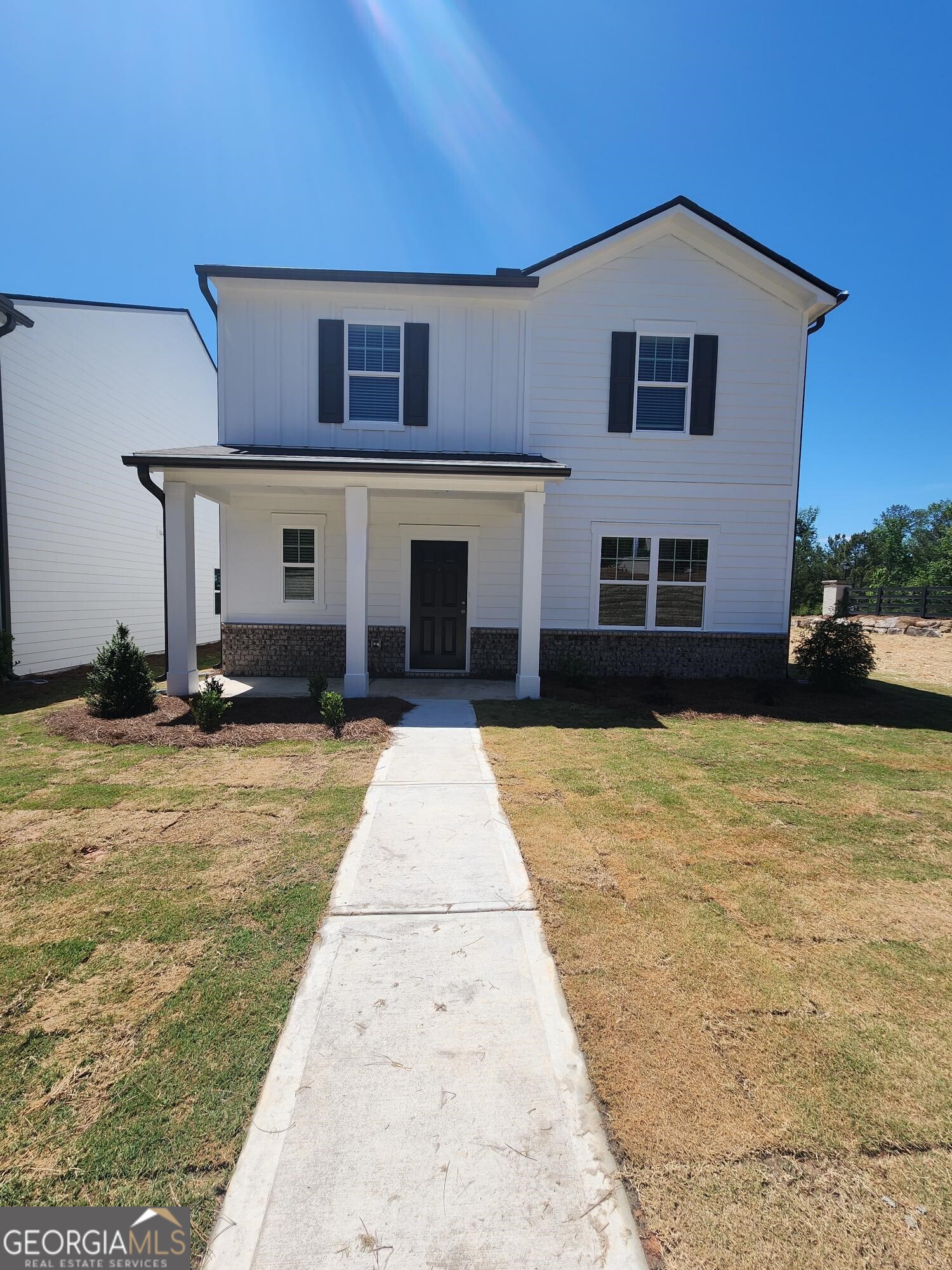 a front view of a house with a yard