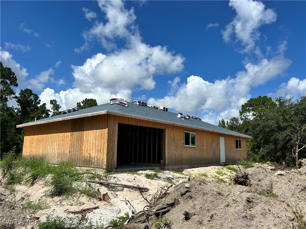 a house with trees in the background